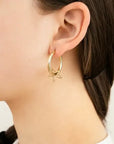 Grote oorringen met open ster goud in oor-LAcollections